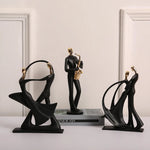 statue musicien moderne abstraite saxophone guitare noire décoration intérieure couple instrumental résine opaque base