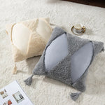 coussin brodé géométrique moderne toile coton couleur beige pompons décoratif