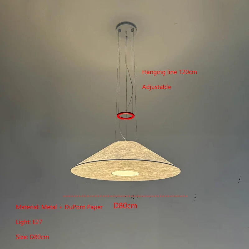 suspension lumineuse moderne minimaliste beige clair abatjour opaque câbles métalliques rouge salon chambre