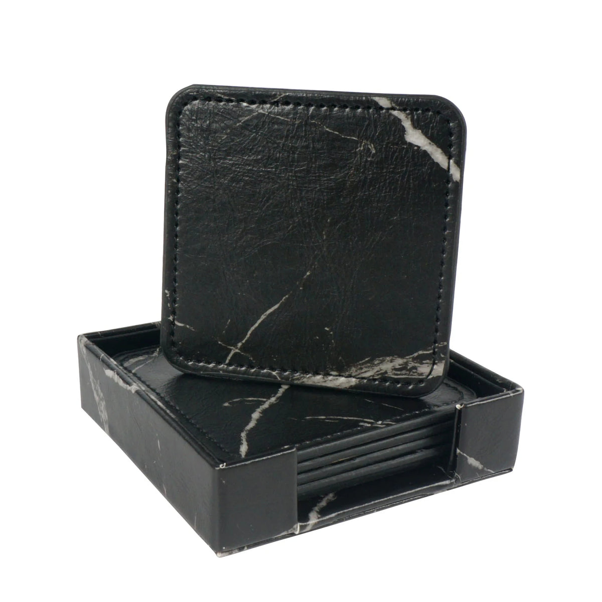 Élégants sous-verres en marbre noir, élégamment rangés dans une boîte assortie, offrant une touche de sophistication à toute table.