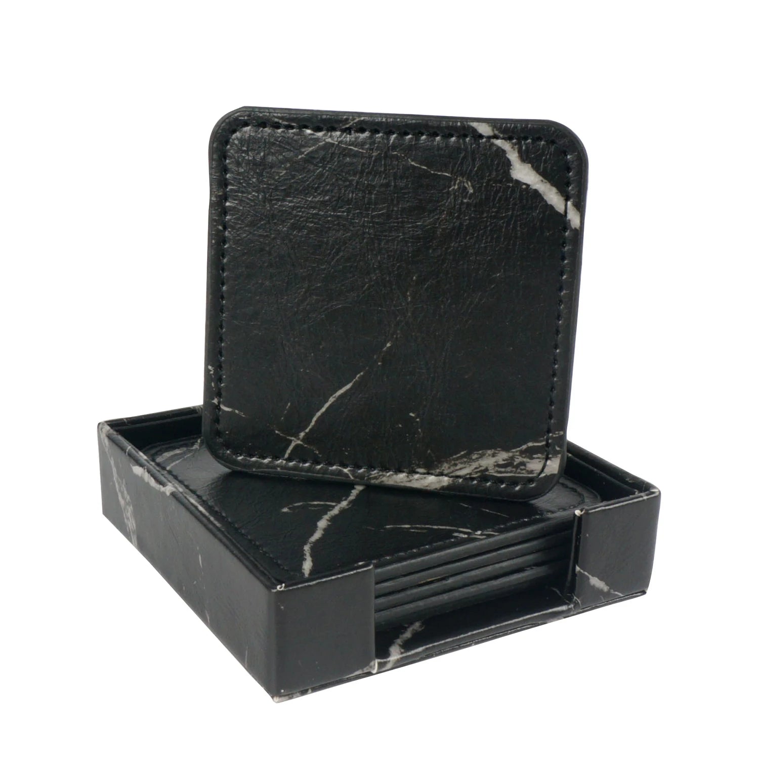 Élégants sous-verres en marbre noir, élégamment rangés dans une boîte assortie, offrant une touche de sophistication à toute table.