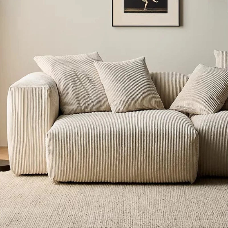 canapé modulaire velours rayures beige clair moderne salon bois oreillers minimaliste