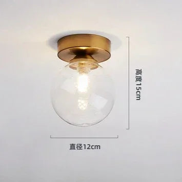 lampe moderne verre transparent noir doré élégante sphérique éclairage contemporain