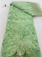 dentelle africaine brodée fleurs sequins bleu blanc vert orange translucide mariage
