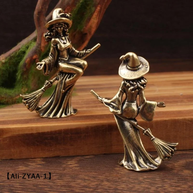 statuette féminine sorcière robe longue baguette magique balai art deco bronze doré intérieur
