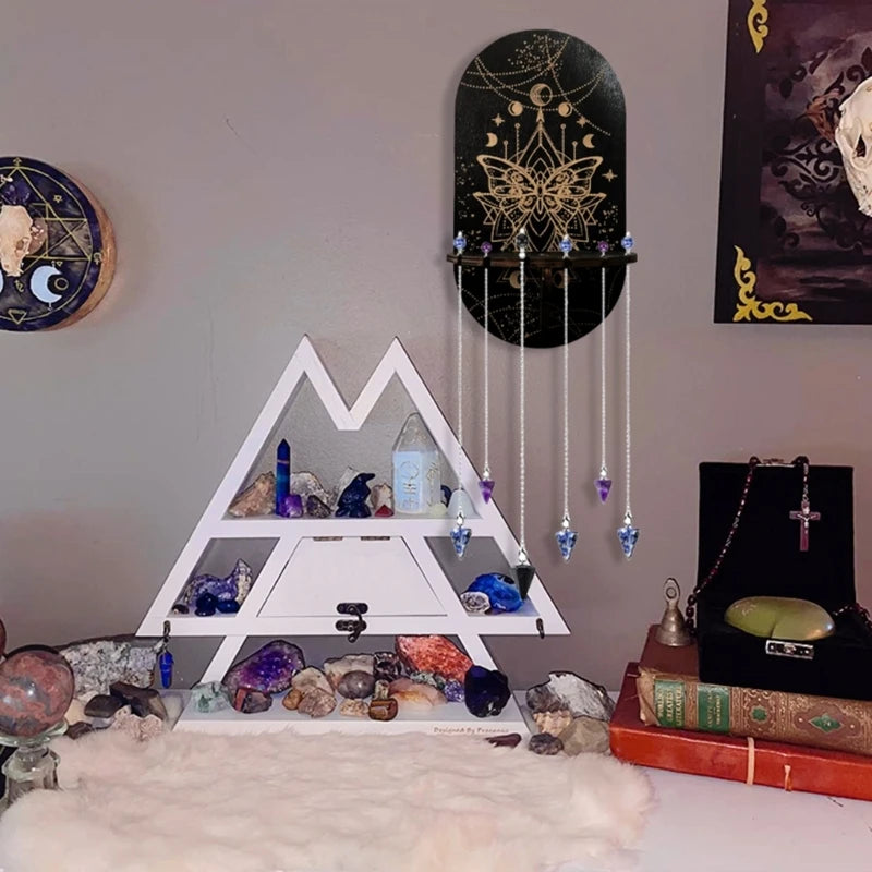 étagère murale noire dorée ornementations astrologiques pendeloques semi précieuses artisanal