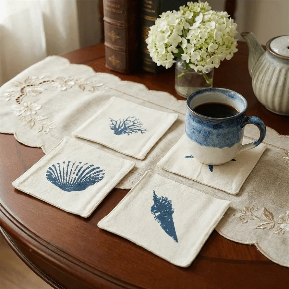 serviettes table classiques marin imprimées coquillages étoiles mer plumes géométriques blanc bleu marine