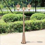 lampadaire extérieur or noir verre translucide vintage élégant détails sculptés deux lampes abat jours