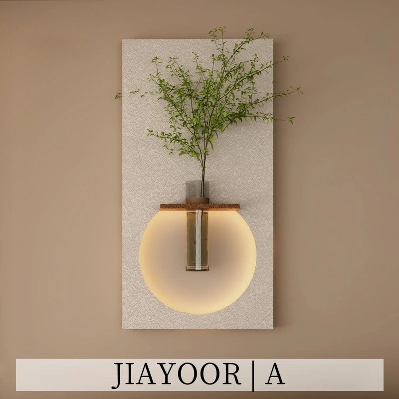 lampe murale moderne blanc doré vert clair texture granulée fixée plante verte vase transparent