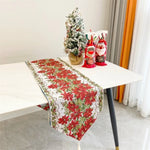 table table noël fleurs poinsettia feuilles vertes bordure dorée classique festif blanc rouge vert