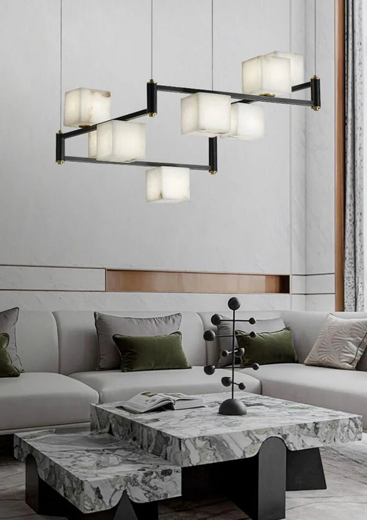 suspension lumineuse moderne marbre noir blanc or rose fixée câbles chambre salon