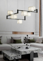 suspension lumineuse moderne marbre noir blanc or rose fixée câbles chambre salon