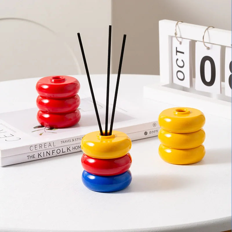 diffuseur huiles essentielles moderne minimaliste rouge jaune bleu noir beige vert géométrique circulaire brillant