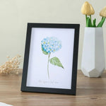 cadres photo bois clair marron modernes minimalistes suspensions posées impressions florales