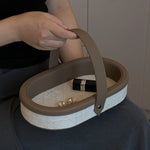 sac main cuir beige noir utilisation multiple respectueux environnement moderne chic porte clés bijoux