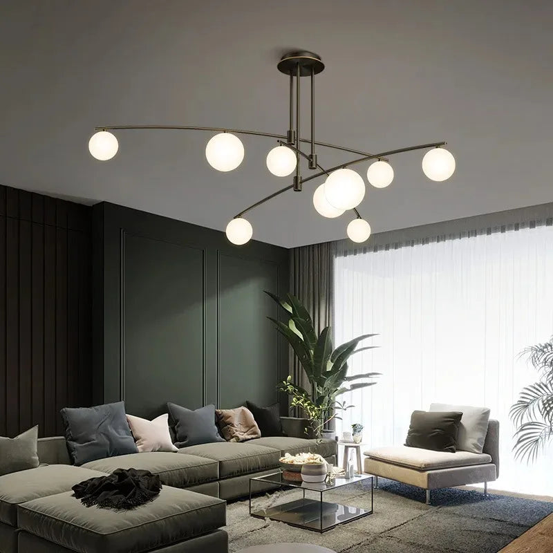 luminaire suspension moderne sphères translucides structure métallique dorée éclairage salon salle manger chambre