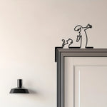 décoration murale moderne silhouette humaine toilette chat fleur papillon métal noir minimaliste
