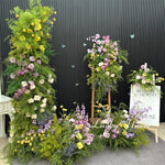 décoration murale naturelle composition florale variée couleurs vives rustique bienvenue mariage