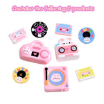 jouets miniatures rétro rose blanc bleu jaune noir radiographe tourne disque cassettes vinyles