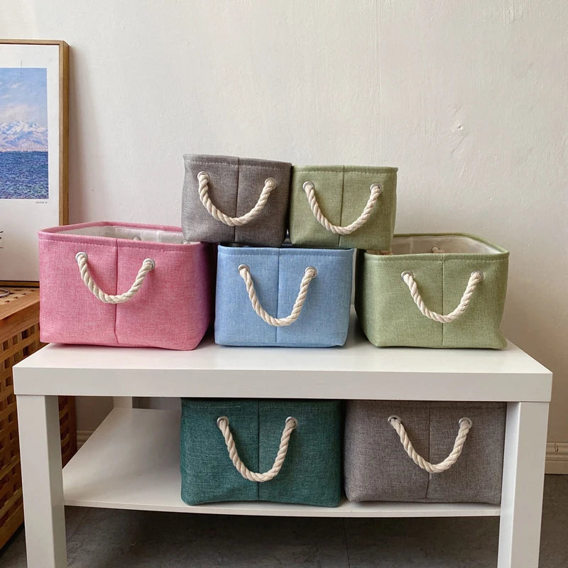 paniers rangement toile lin rose gris bleu vert modernes pliables poignées anneaux métalliques