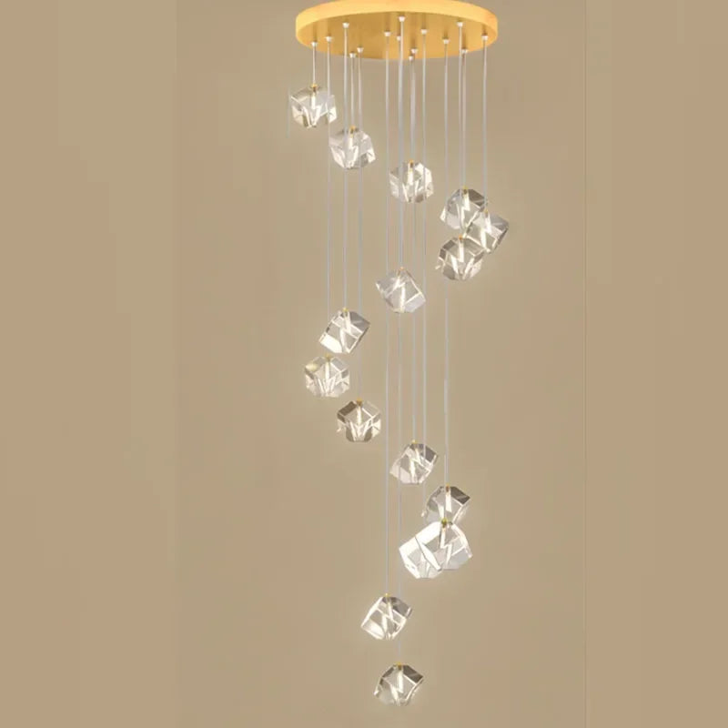 suspension lumineuse moderne transparente dorée facettes géométriques élégantes multiples lampes