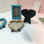 cadre photo moderne rondes orange noir bleu clair rose doré blanc clips noirs fond