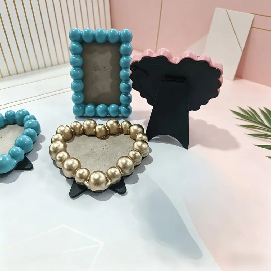 cadre photo moderne rondes orange noir bleu clair rose doré blanc clips noirs fond