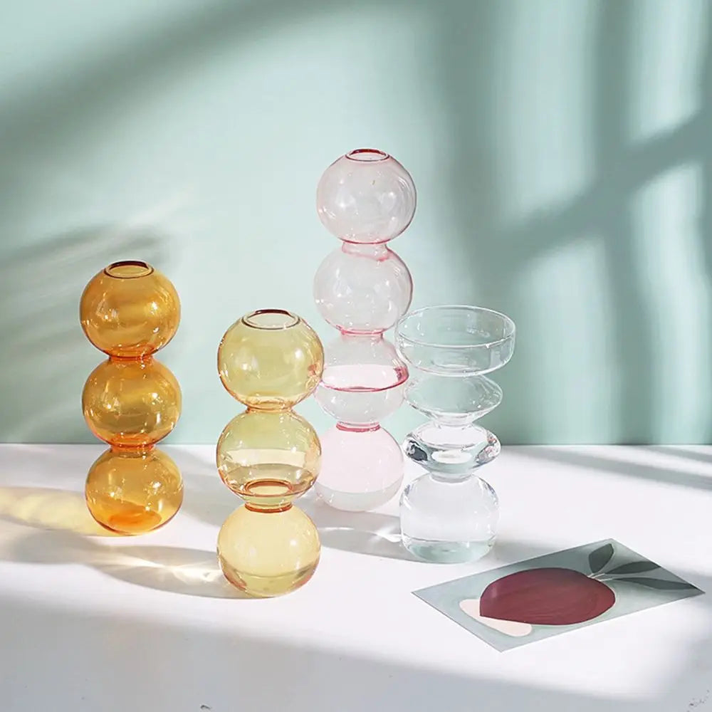 vases verre transparent moderne orange rose sphères empilées décoration maison table fleurs hydroponiques