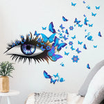 sticker mural moderne oeil stylisé papillons fleurs bleu rose violet noir chambre coucher