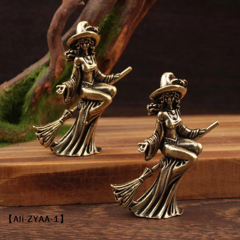 statuette féminine sorcière robe longue baguette magique balai art deco bronze doré intérieur