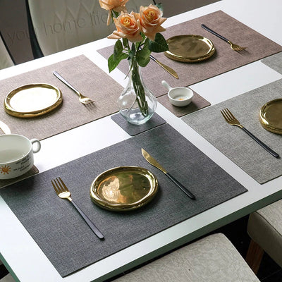 Set de 6 sets de table en simili cuir lavable vert sur table à manger