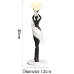 sculpture décorative moderne figure féminine globe lune noir blanc bleu clair résine chambre salon