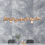 suspension lumineuse moderne doré blanc boules métalliques sphères translucides câble fixé nordique éclairage intérieur