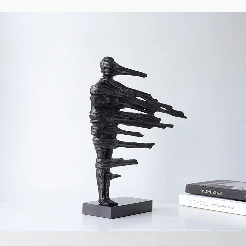 sculpture moderne abstraite figures noires texture rugueuse ligne horizontale décoration intérieure chambre