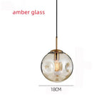 suspension lumineuse moderne transparente dorée ampoule câble noir minimaliste salle manger chambre