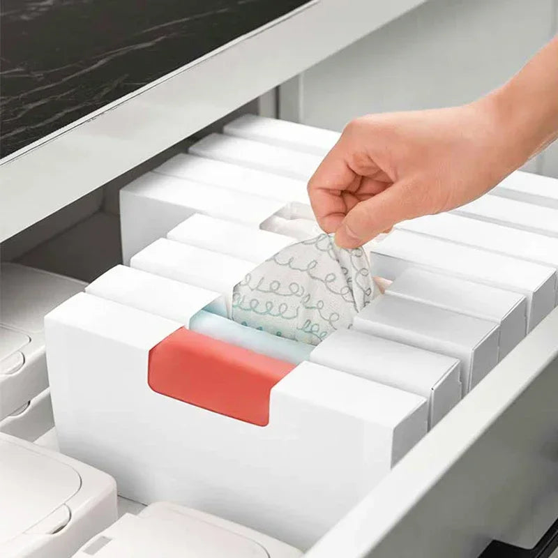 rangements sacs plastique blanc moderne stockage sacs poubelles cuisine tiroirs organisation économique écologique