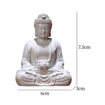 statue bouddha zen blanc gris bois décoratif assiette cigarettes tapis fibres naturellements éléments divers