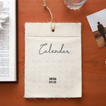 calendrier mural tissu beige clair rustique minimaliste clip magnétique ficelle décembre 2026 opaque