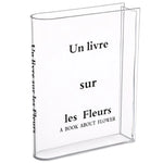 vase transparent moderne texte livre fleurs variées décoration intérieure minimaliste