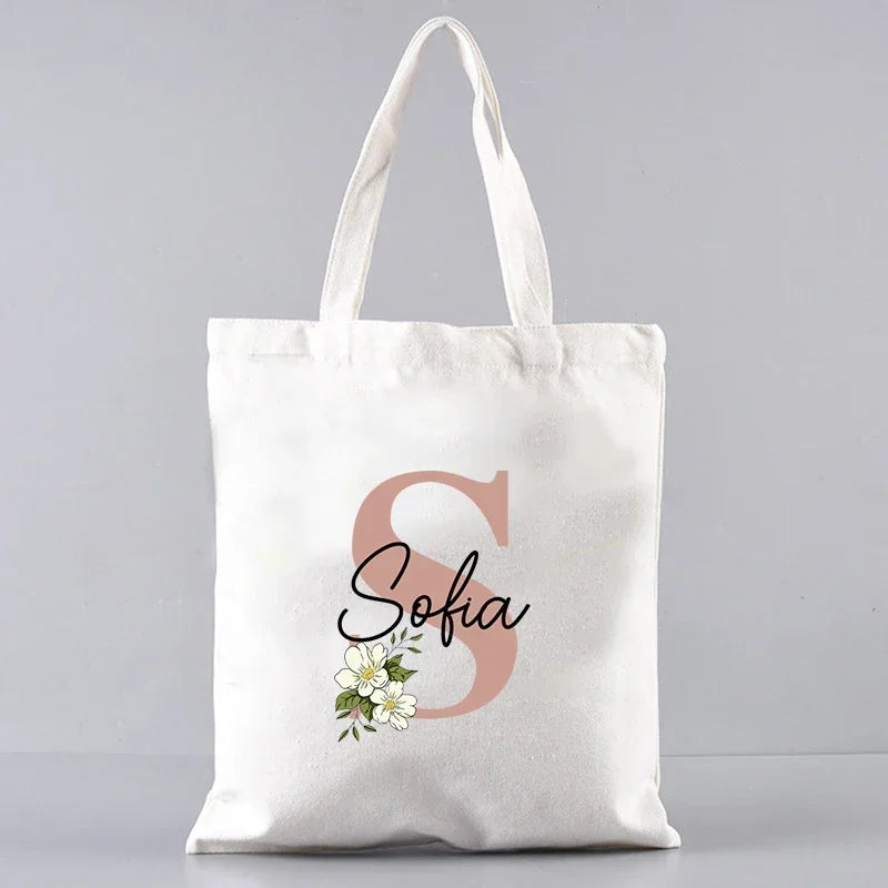 sac main femme toile blanche motif fleurs lettres grandes poignées réutilisable moderne