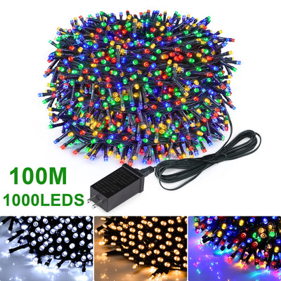 Guirlande lumineuse LED étanche 50m illuminant un jardin de nuit