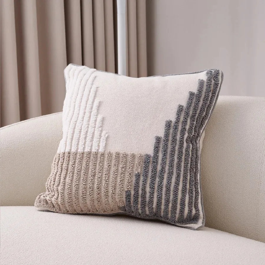 taies d'oreiller géométriques brodées contemporaines beige gris blanc pompons respectueux environnement