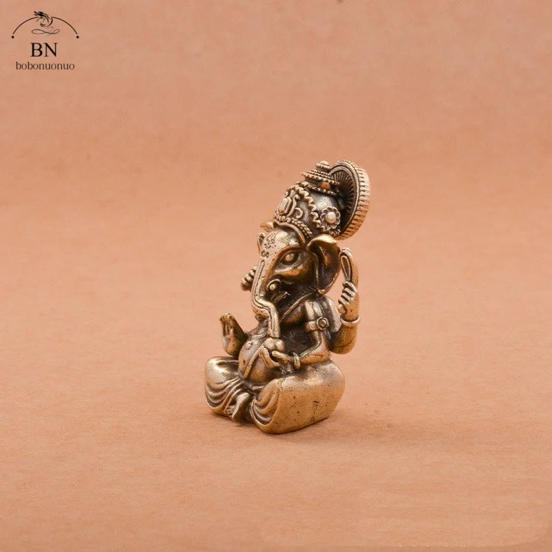 statuette ganesha bronze doré sculptée details complexes religieuse traditionnelle décoration intérieure éléphant dieuhindou ornement