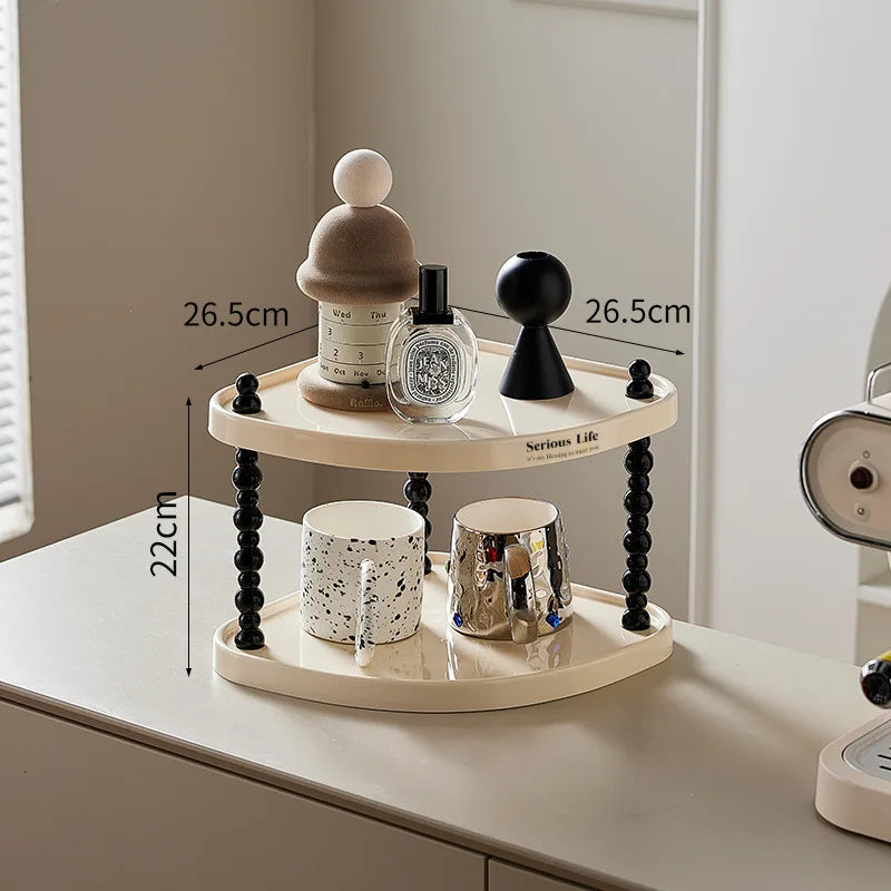 étagère trois niveaux moderne minimaliste blanc noir cosmétiques parfums tasses blancs