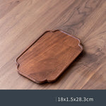 assiettes bois marron clair feuilles modernes métalliques thé tasses théière fruits noix