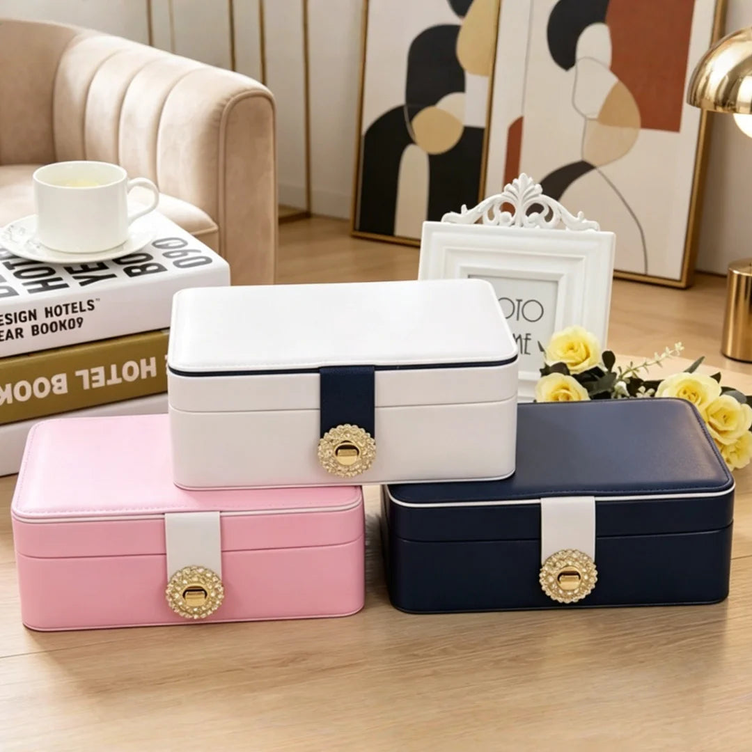 boîtes bijoux simili cuir bleu marine blanc rose pâle compartiments montres boucles doreilles modernes