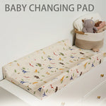 tapis changement bébé beige bleu clair imprimé dinosaures poissons ceinture sécurité moderne pratique