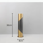 vase decoratif moderne noir doré geometrique arrangement fleurs table minimalistebranches feuilles rougeOpaque matelasse