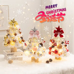 Sapin de Noël olive 60cm avec lumières allumées dans salon