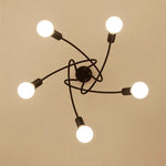 suspension lumineuse moderne noir doré ampoules blanches structure spirale fixation câbles métallique